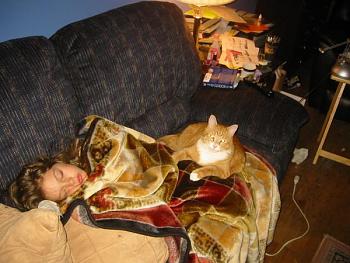 Nancy asleep on the couch w/ her cat, 7/6/08.