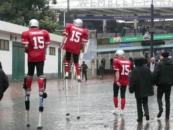 Entertaining the people walking from the train to the stadium